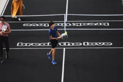 boy on a pickleball court