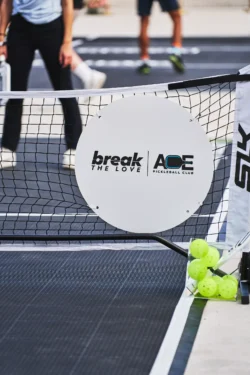 Break the Love sign attached to a pickleball net